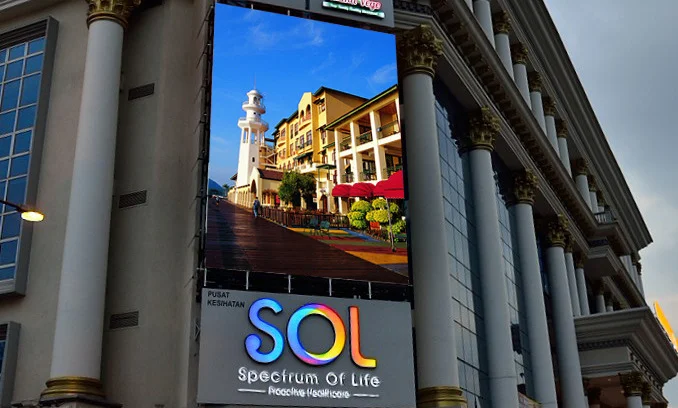 A large building is using an outdoor LED display screen.