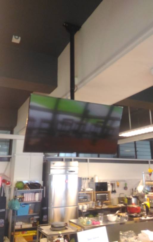 A Hanging Digital Signage Display being used at Eunoia Junior College's Music Shop Haus Cafe.