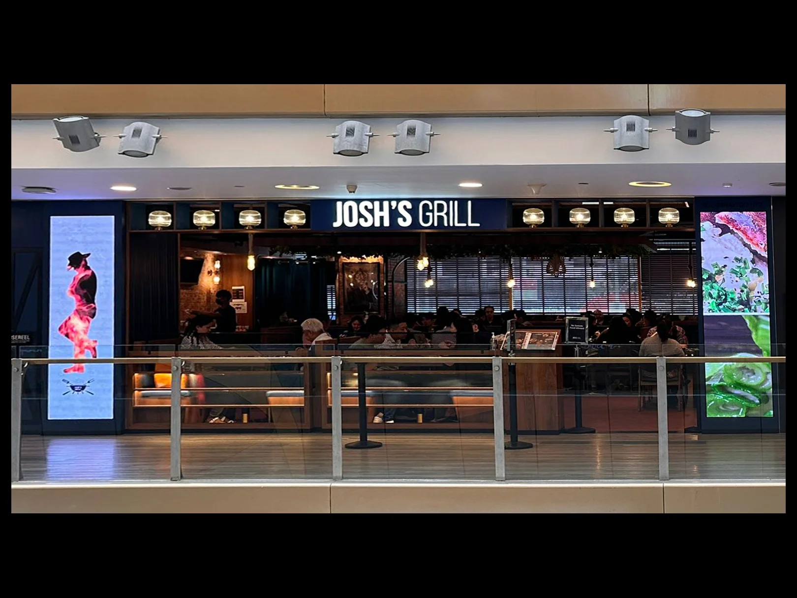 Josh's Grill having LED digital signage to advertise.