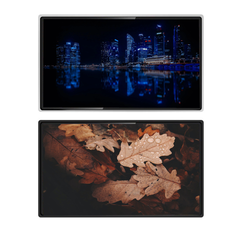 A digital signage display with a split screen showing a city skyline at night on the top and a close-up photo of a leaf with water droplets on the bottom.