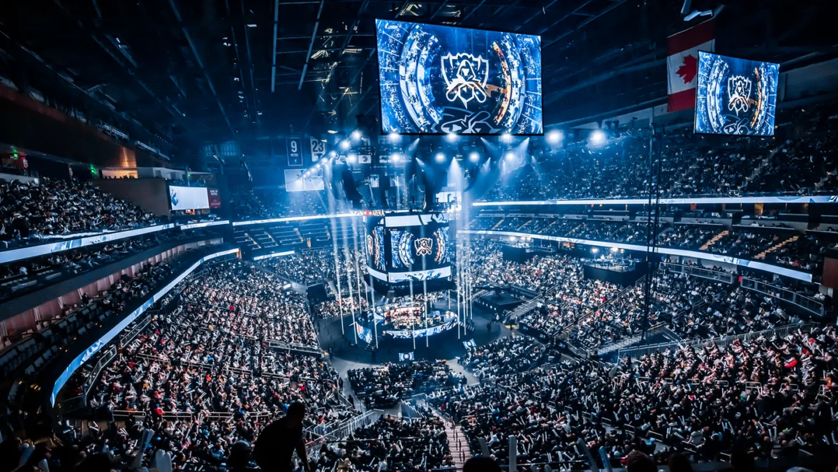 Large, bright LED screens showcasing esports gameplay, tournament